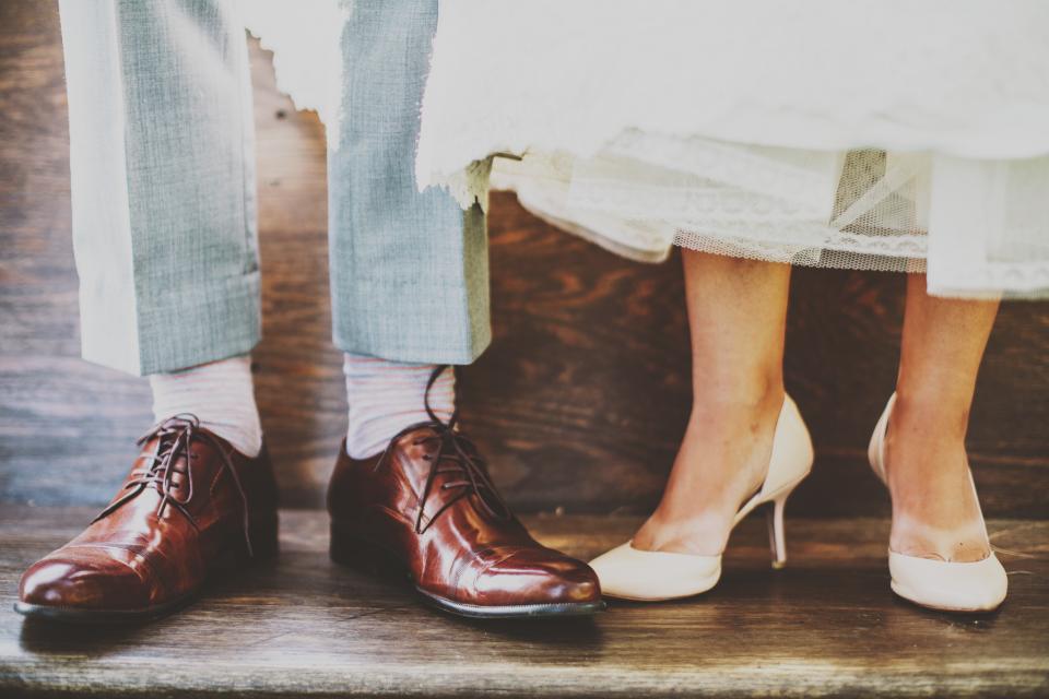 The bride and groom shoes side by side